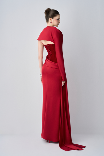 Red evening gown with cape on a white background