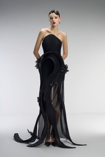 A black gown with floral details