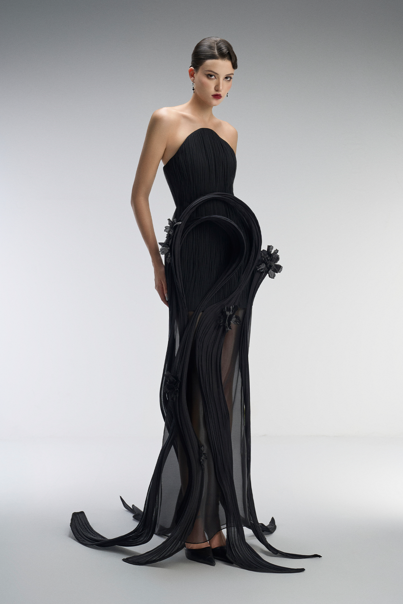 A black gown with floral details