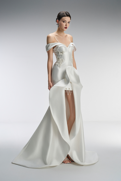 White wedding dress with floral details on a gray background