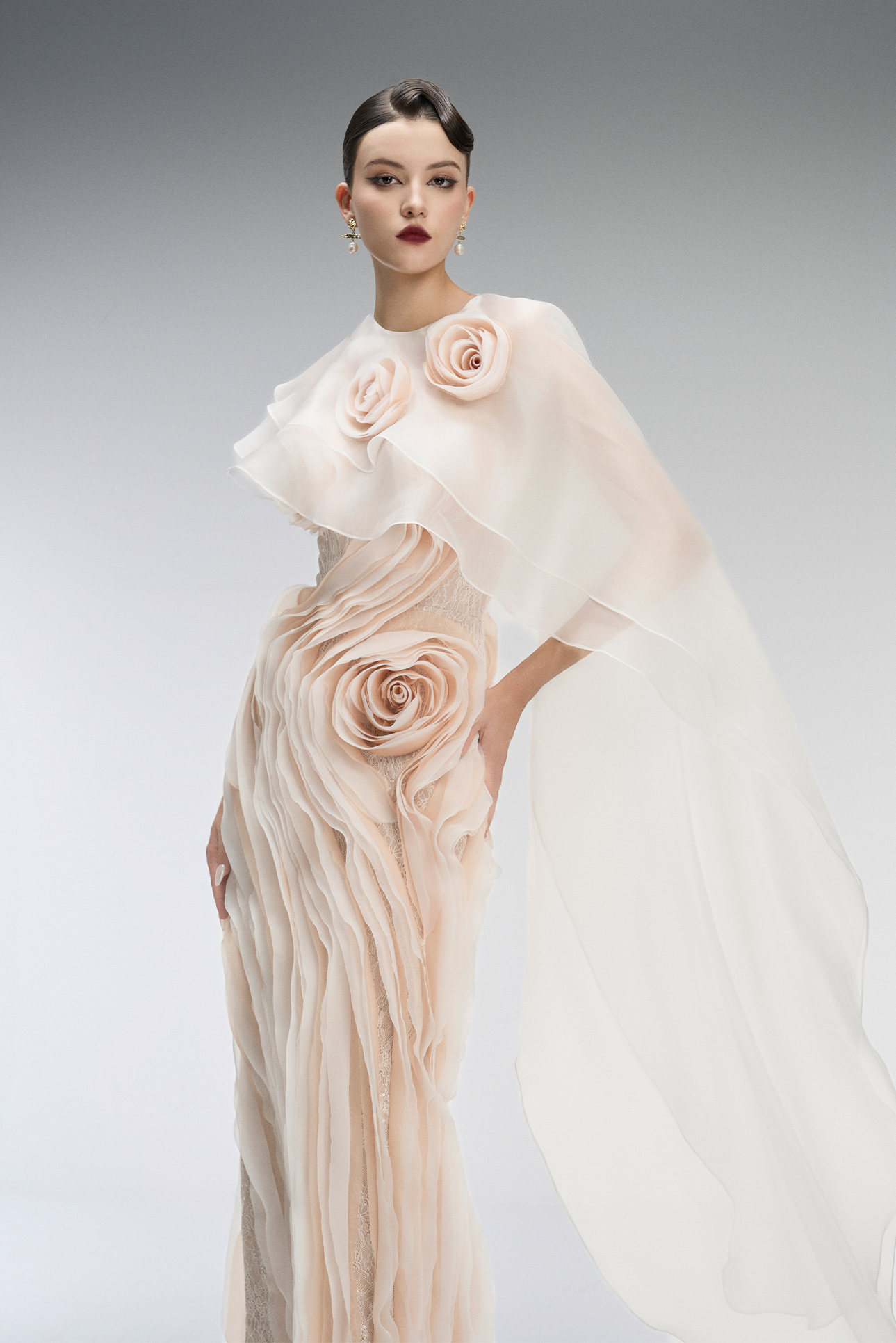 A elegant gown with floral details on a plain background