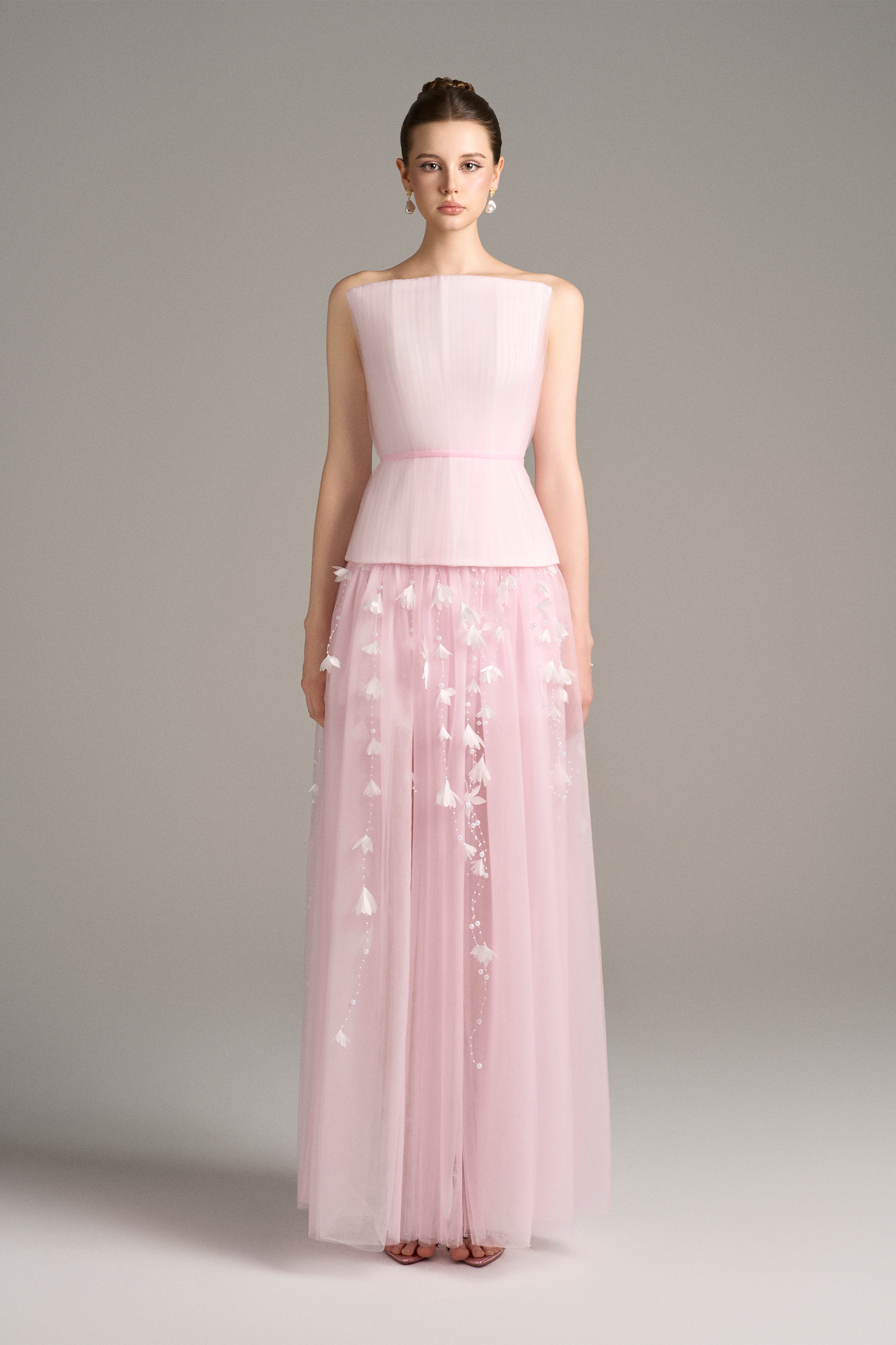 Front full view of Aveta pastel pink maxi dress set with structured corset top, square neckline, and long layered sheer skirt with delicate pearl floral embellishments.