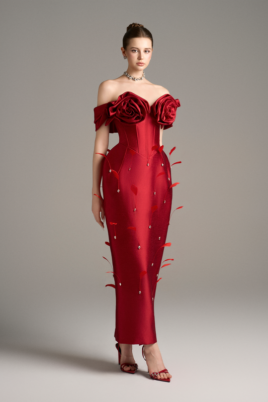  Elegant off-shoulder red maxi dress with handcrafted 3D roses, a corset bodice, and crystal bead and feather embellishments, showcasing a sophisticated design.