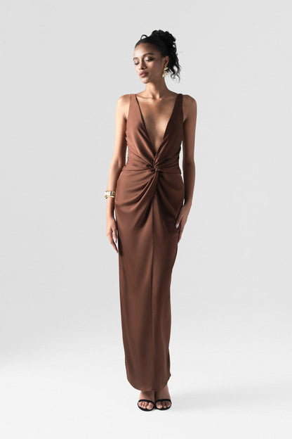 The brown silk maxi dress detailed with a deep V-neck and innovative 3D twist at the waist. 