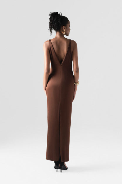 The brown silk maxi dress detailed with a deep V-neck and innovative 3D twist at the waist. 