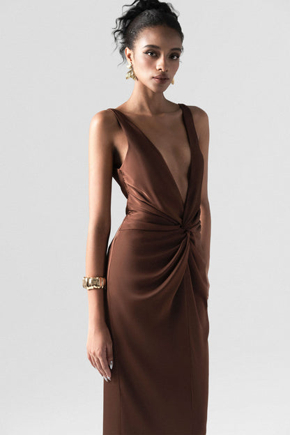 The brown silk maxi dress detailed with a deep V-neck and innovative 3D twist at the waist. 