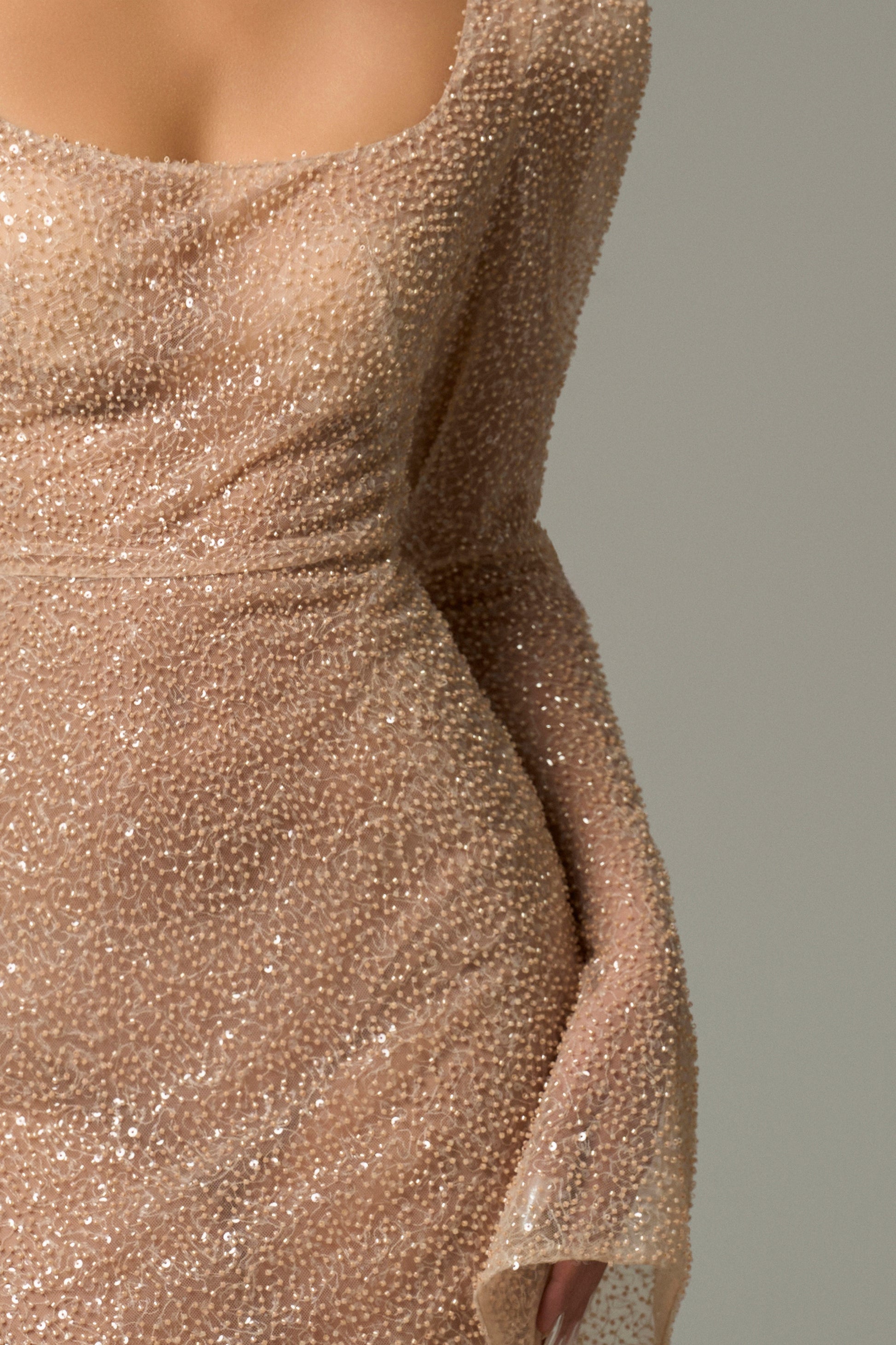 Nude Body Hugging Maxi Dress is crafted from luxury beaded mesh.