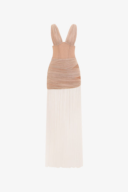 the beige evening dress in shimmering fabric, featuring a sheer, flowing skirt, cut-outs.