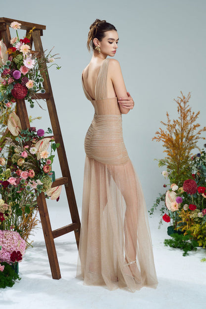 the beige evening dress in shimmering fabric, featuring a sheer, flowing skirt, cut-outs.