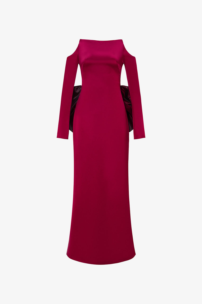 Red evening gown in silk with off-shoulder neckline and a oversized bow.