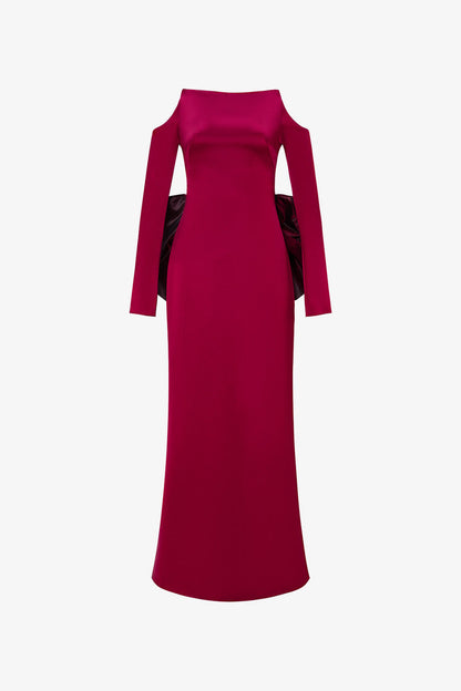 Red evening gown in silk with off-shoulder neckline and a oversized bow.
