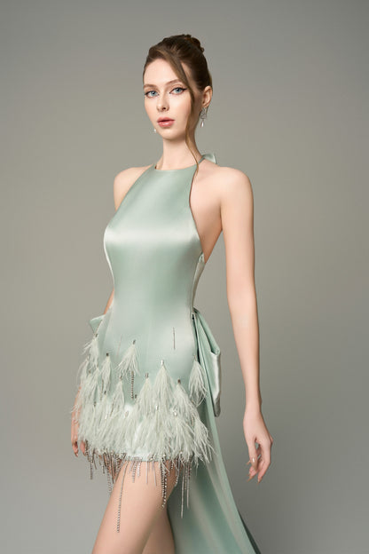 Turn heads in Light Green Silk Mini Dress, featuring a halter neckline, oversized bow, and crystal embellishments. 