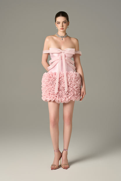 The Pink Floral Embellished Mini Dress features bow strap on bust and hand-sewn floral details.