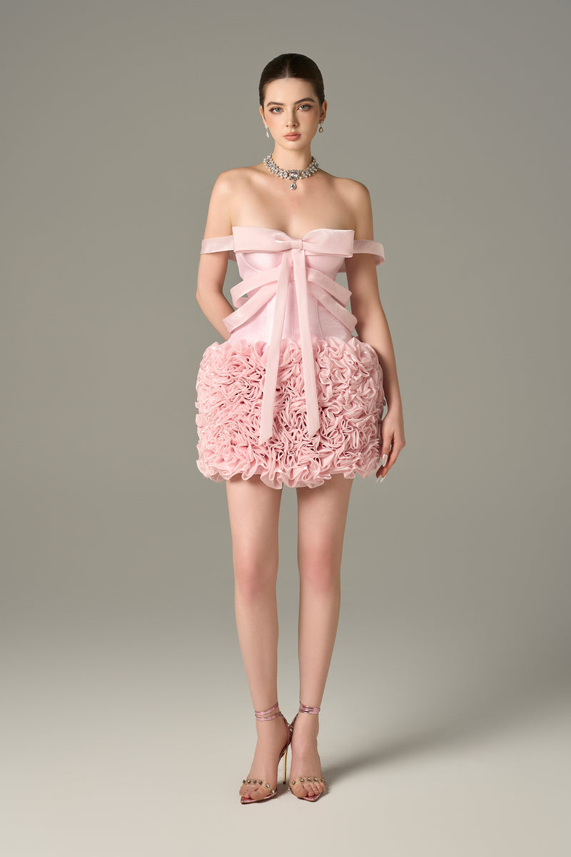 The Pink Floral Embellished Mini Dress features bow strap on bust and hand-sewn floral details.