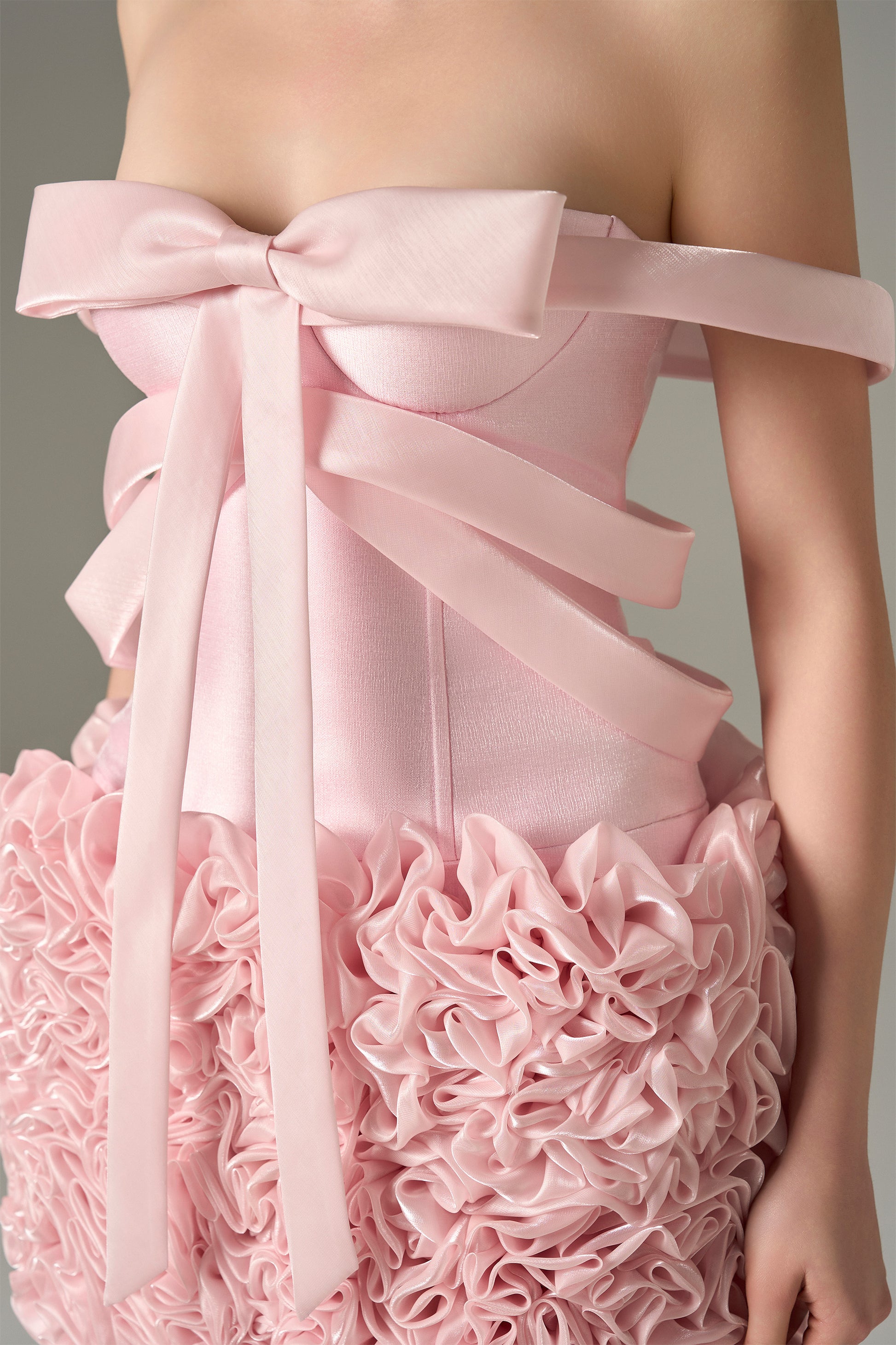 The Pink Floral Embellished Mini Dress features bow strap on bust and hand-sewn floral details.