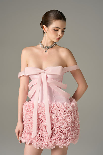 The Pink Floral Embellished Mini Dress features bow strap on bust and hand-sewn floral details.