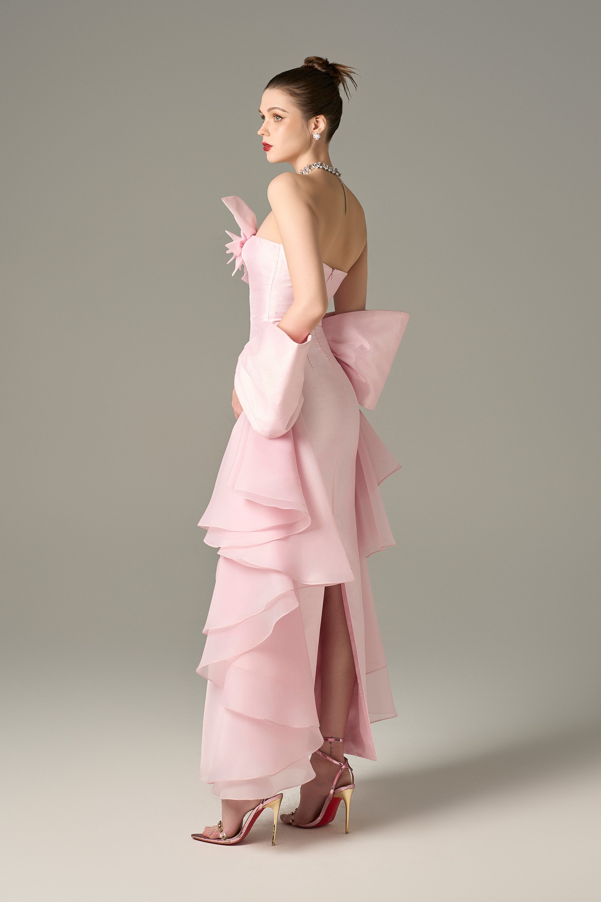 The pink dress with many layers of fancy chiffon brings elegance.