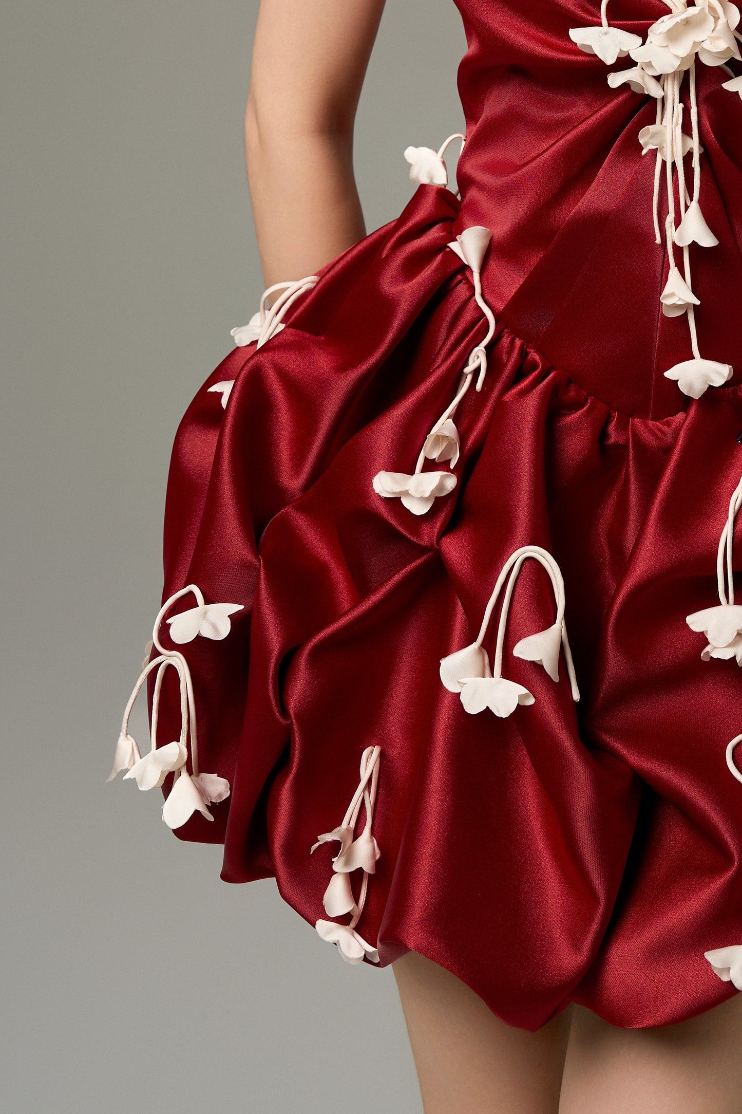Red Silk Strapless 3D Floral Mini Dress features delicate pleating, a flared skirt with smocking details, and handmade silk flowers