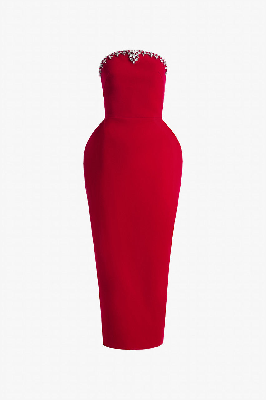 Red evening dress in velvet, with a bodycon silhouette, puff hips, and a dome-shaped neckline.