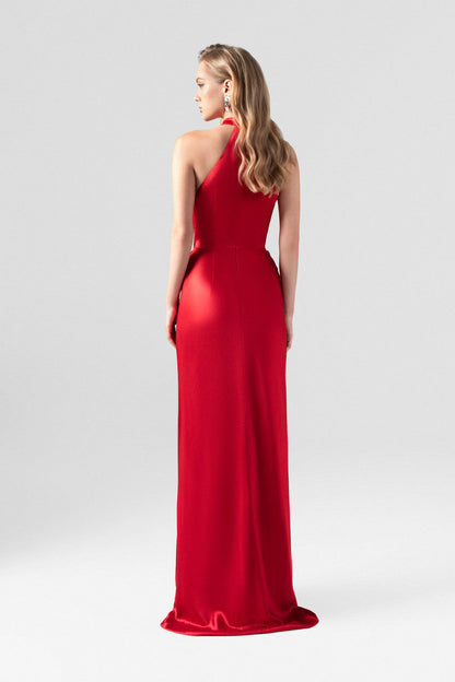 Red evening dress in silk with plunging neckline, sleeveless halter design.