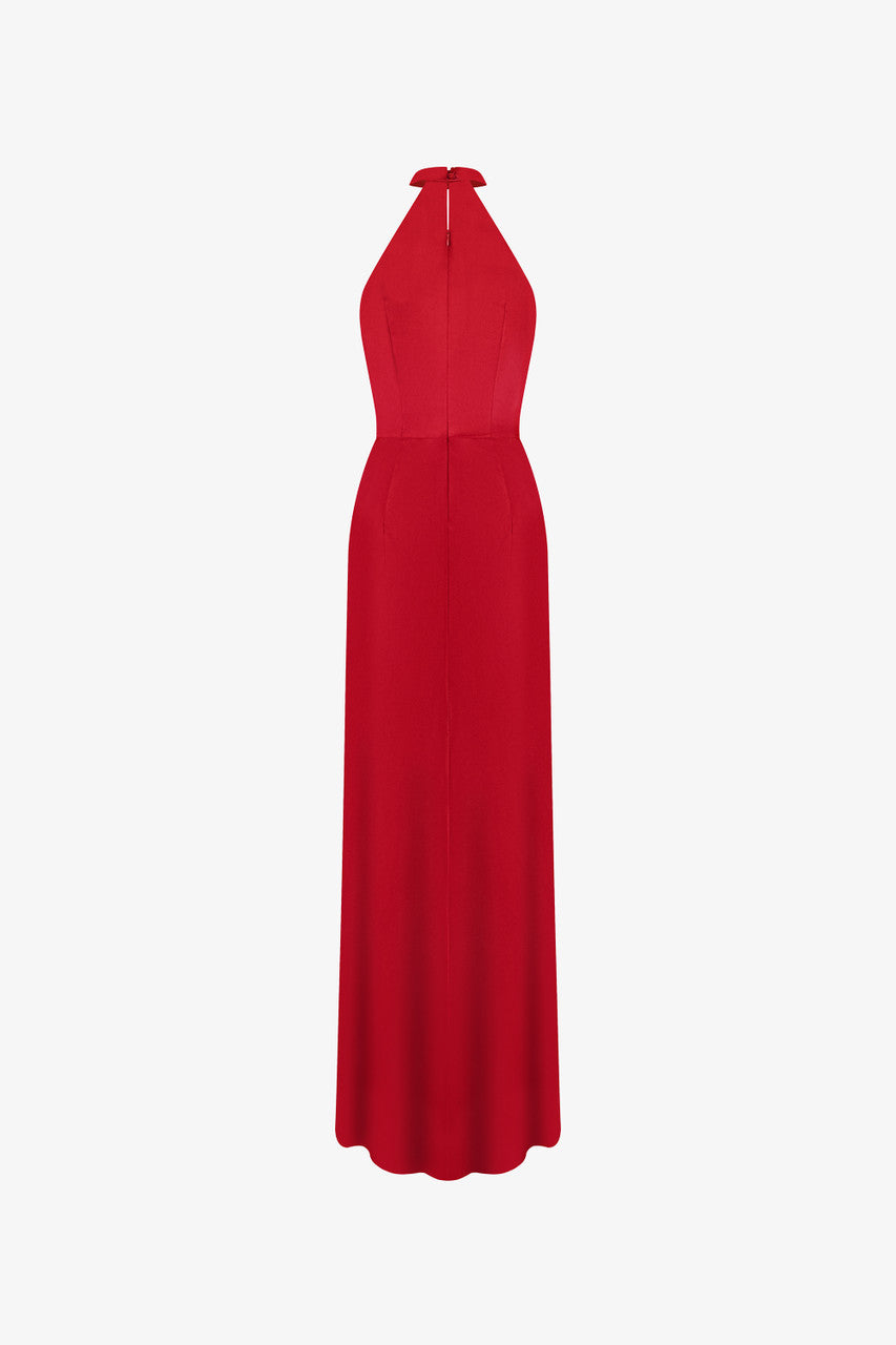 Red evening dress in silk with plunging neckline, sleeveless halter design.