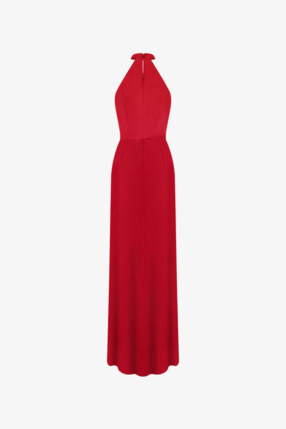 Red evening dress in silk with plunging neckline, sleeveless halter design.