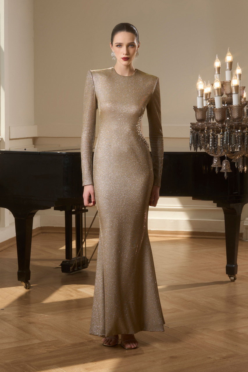 Gold evening dress in shimmering elastic material with a heart-shaped waist cutout, intricate embellishments.