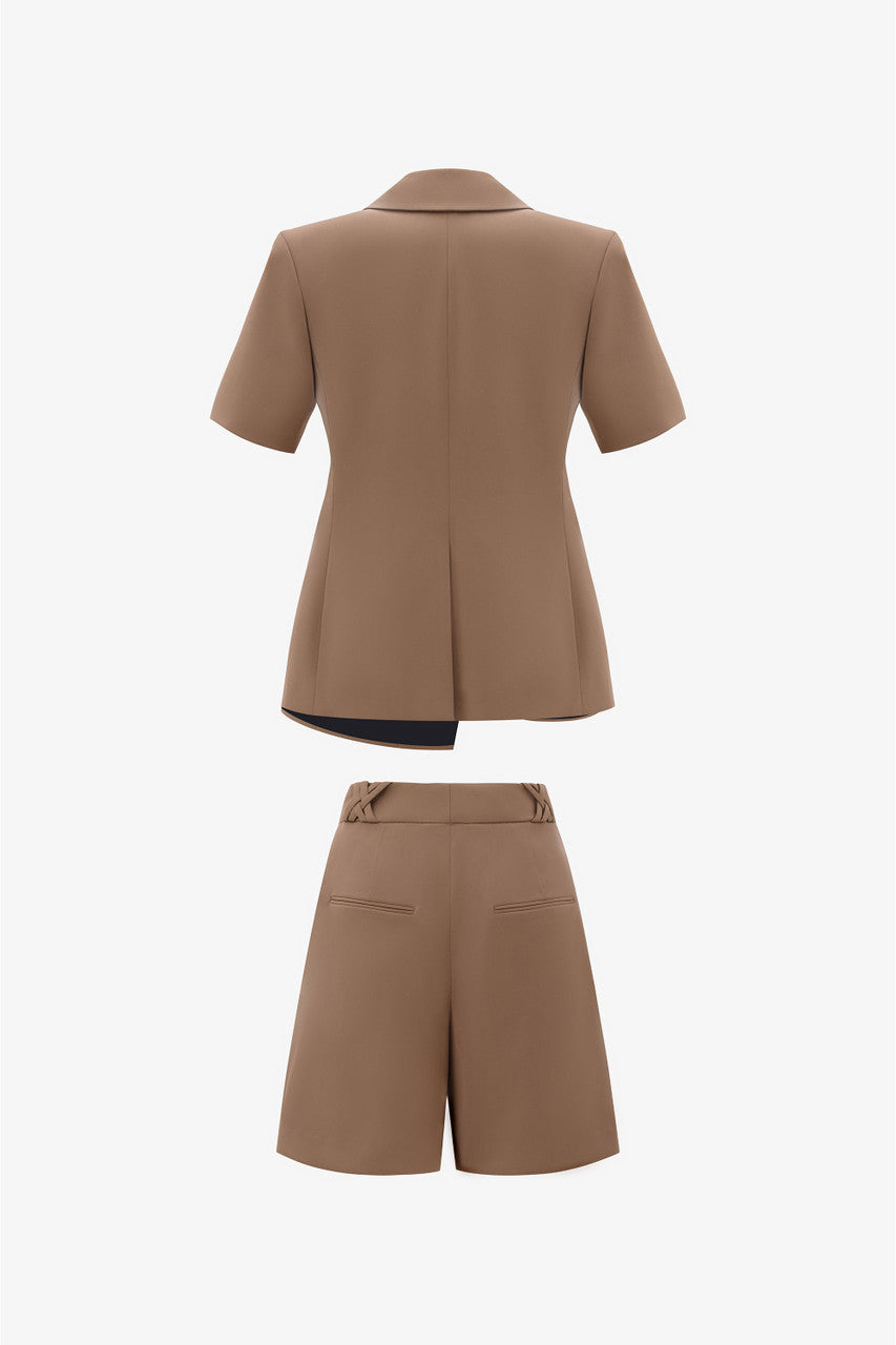 The short-sleeve brown blazer with wide padded shoulders and short menswear with chic waistband detail.