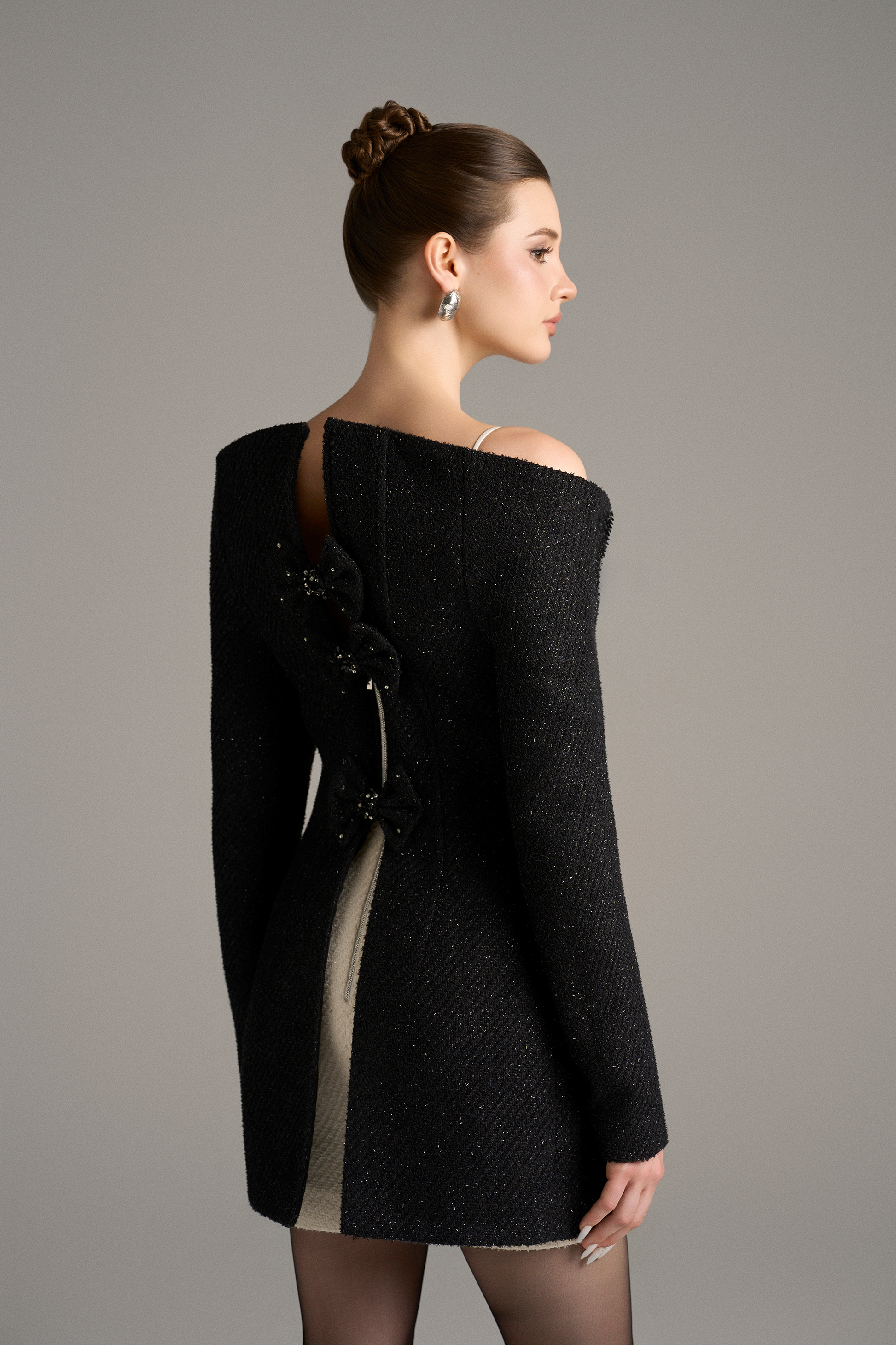 Woman wearing a black off-shoulder dress