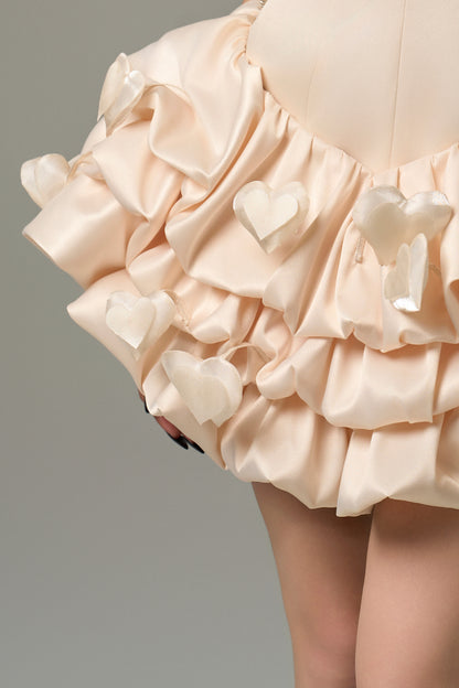 Cream silk mini dress with bodycon fit, bold cutout at bust and puffy skirt.